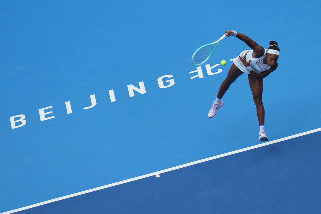 Coco Gauff, of the United States serves against Eva Lys, of Germany during the women's singles quarterfinals match of the China Open tennis tournament, at the National Tennis Center, in Beijing, Thursday, Oct. 2, 2025. (AP Photo/Andy Wong)