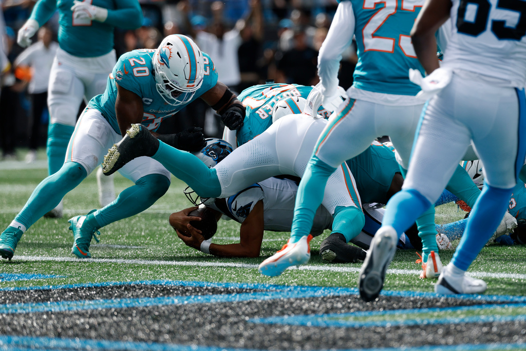 Carolina Panthers running back Rico Dowdle scores against the Miami Dolphins during the second half of an NFL football game, Sunday, Oct. 5, 2025, in Charlotte, N.C. (AP Photo/Rusty Jones)