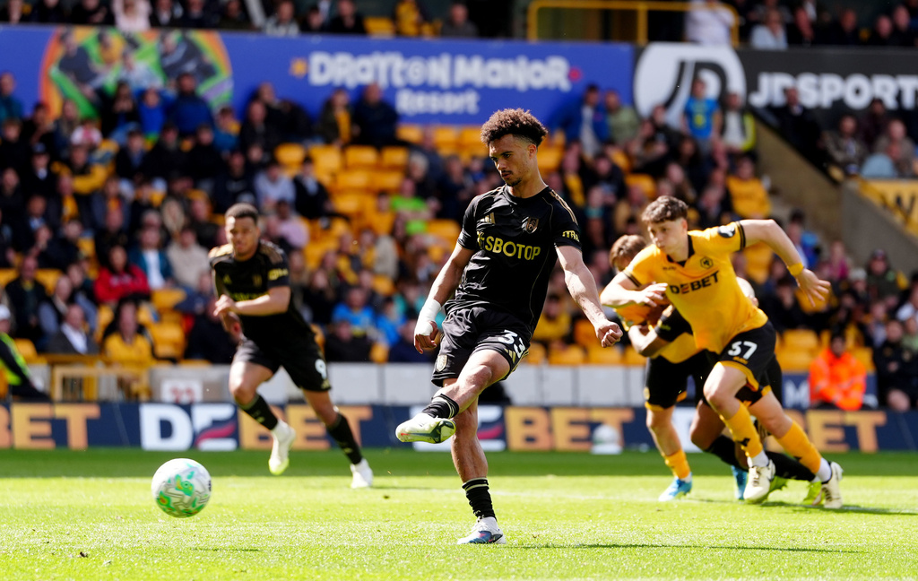 Fulham's Antonee Robinson scores his sides first goal from the penalty spot during their English Premier League soccer match against Wolverhampton Wanderers in Wolverhampton, England, Sunday, May 17, 2026. (David Davies/PA via AP)