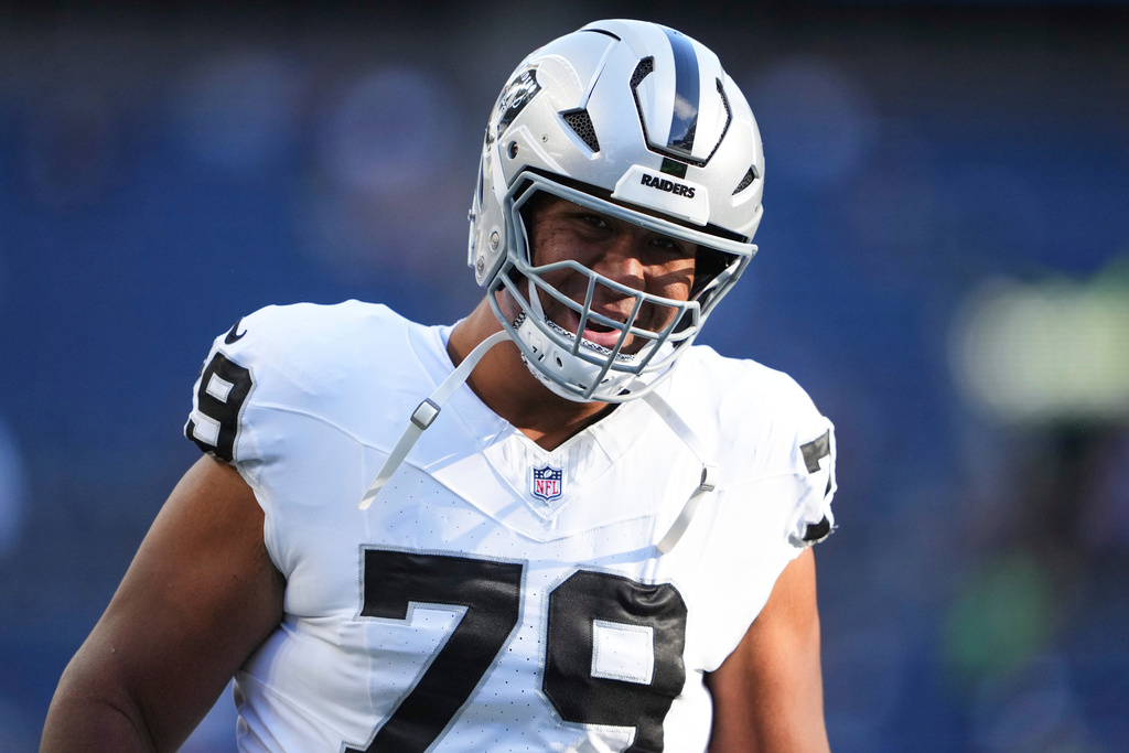 FILE - Las Vegas Raiders offensive tackle Laki Tasi (79) warms up before an NFL preseason football game against the Seattle Seahawks, Thursday, Aug. 7, 2025, in Seattle. (AP Photo/Lindsey Wasson, File)