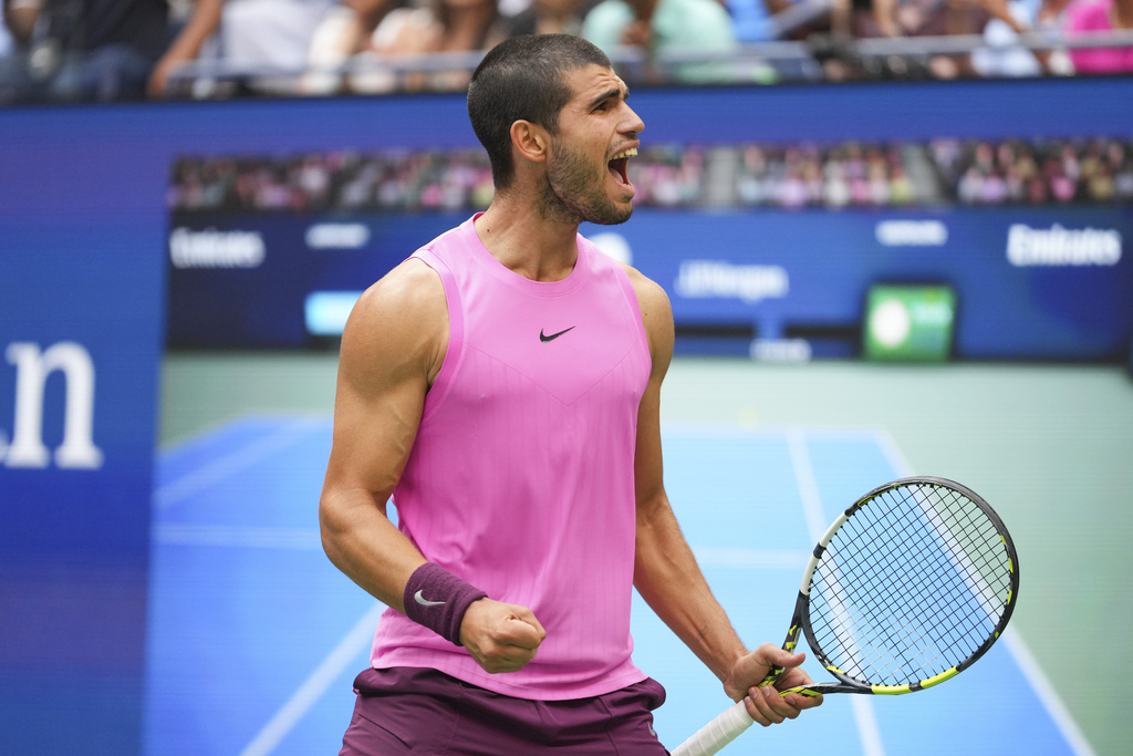 Carlos Alcaraz, of Spain, reacts after defeating Novak Djokovic, of Serbia, during the men's singles semifinals of the U.S. Open tennis championships, Friday, Sept. 5, 2025, in New York. (AP Photo/Kirsty Wigglesworth)