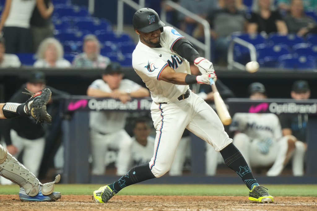 Miami Marlins' Otto Lopez hits a triple to right field during the ninth inning of a baseball game against the New York Mets Wednesday, Sept. 9, 2026, in Miami. (AP Photo/Marta Lavandier)