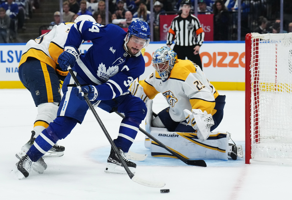 Toronto Maple Leafs' Auston Matthews is stopped by Nashville Predators goaltender Justus Annunen the second period of an NHL hockey game in Toronto on Tuesday, Oct. 14, 2025. (Nathan Denette/The Canadian Press via AP)