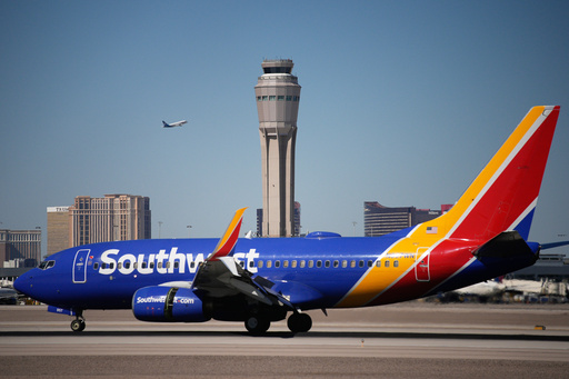 Planes land and take off at Harry Reid International Airport, Tuesday, Oct. 7, 2025, in Las Vegas. (AP Photo/John Locher) Planes land and take off at Harry Reid International Airport, Tuesday, Oct. 7, 2025, in Las Vegas. (AP Photo/John Locher)