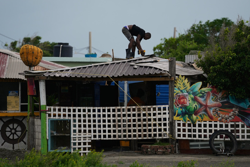 A man fortifies a roof ahead of the forecast arrival of Hurricane Melissa in Kingston, Jamaica, Sunday, Oct. 26, 2025. (AP Photo/Matias Delacroix) A man fortifies a roof ahead of the forecast arrival of Hurricane Melissa in Kingston, Jamaica, Sunday, Oct. 26, 2025. (AP Photo/Matias Delacroix)