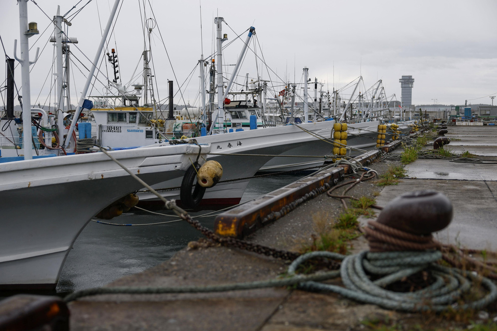 Vessels are moored at a fishing port in Oarai, Ibaraki prefecture, Japan Tuesday, Aug. 11, 2026, as Tropical Storm Chan-hom approaches. (Kota Endo/Kyodo News via AP)