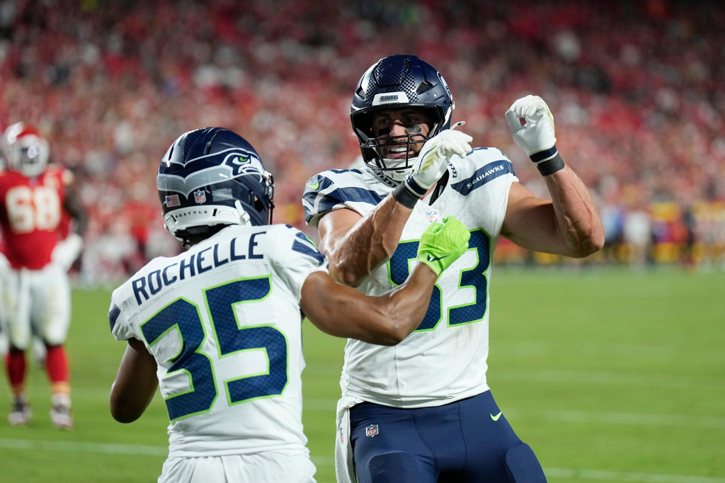 Seattle Seahawks tight end Nick Vannett (83) celebrates his touchdown against the Kansas City Chiefs with Seahawks wide receiver Rashad Rochelle (35) during the second half of a preseason NFL football game, Friday, Aug. 28, 2026, in Kansas City, Mo. (AP Photo/Charlie Riedel)