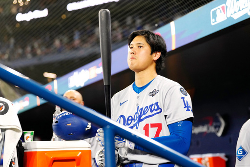 Los Angeles Dodgers' Shohei Ohtani (17) waits in the dugout ahead of the top of the seventh inning of Game 1 of baseball's World Series against the Toronto Blue Jays in Toronto, Friday, Oct. 24, 2025. (Frank Gunn/The Canadian Press via AP) Los Angeles Dodgers' Shohei Ohtani (17) waits in the dugout ahead of the top of the seventh inning of Game 1 of baseball's World Series against the Toronto Blue Jays in Toronto, Friday, Oct. 24, 2025. (Frank Gunn/The Canadian Press via AP)