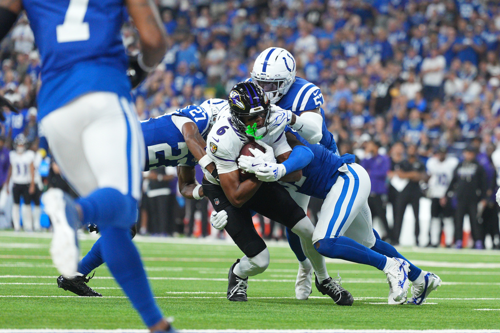 Baltimore Ravens' Ja'kobi Lane is stopped on a fourth down play during the first half of an NFL football game against the Indianapolis Colts Sunday, Sept. 13, 2026, in Indianapolis. (AP Photo/AJ Mast)