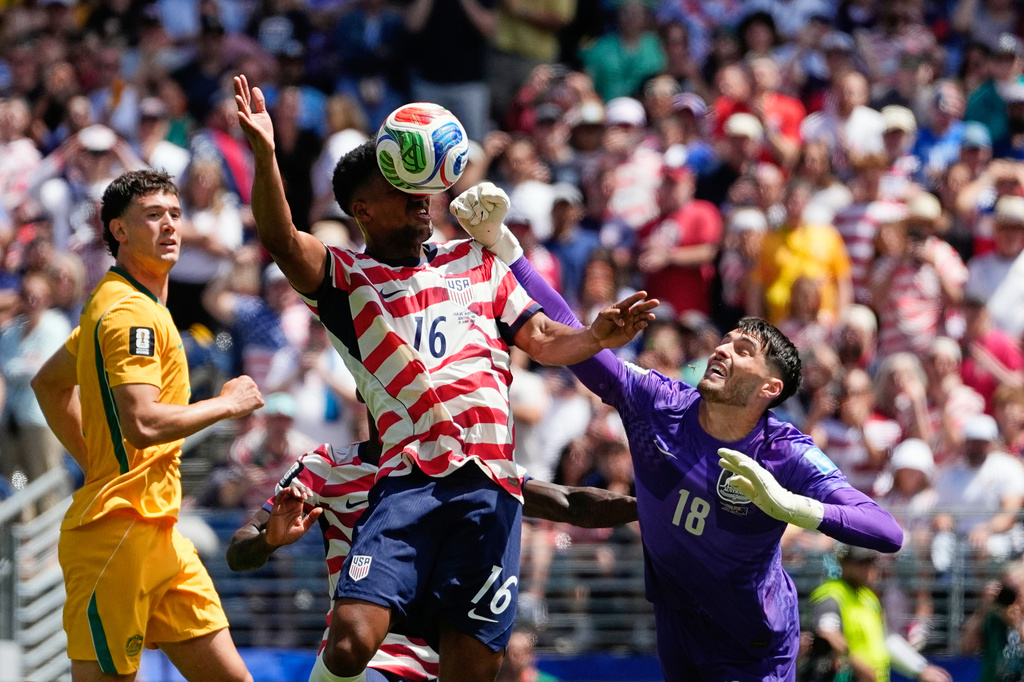Australia goalkeeper Patrick Beach fails to stop a goal by United States' Alex Freeman, center, during the World Cup Group D soccer match between the United States and Australia in Seattle, Friday, June 19, 2026. (AP Photo/Lindsey Wasson)