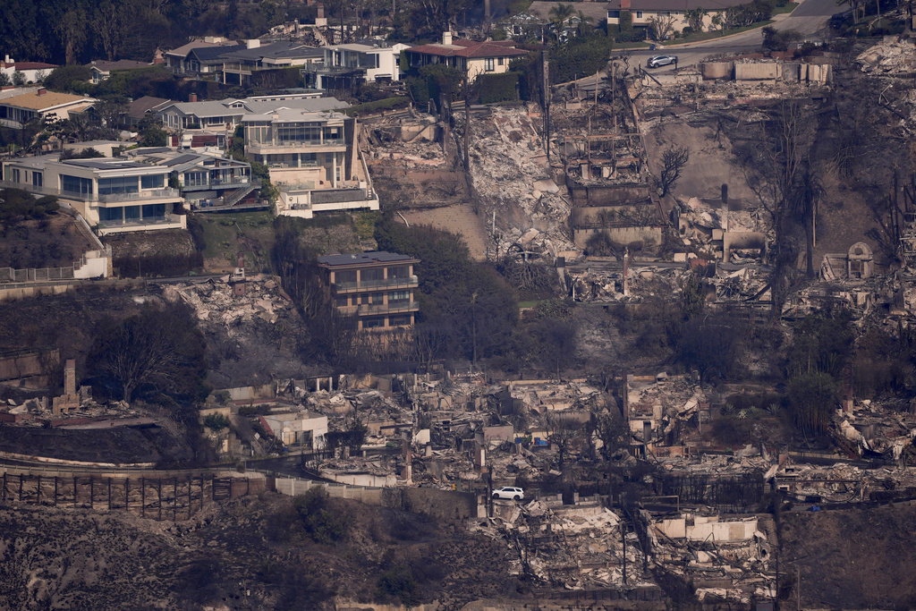 The devastation from the Palisades Fire is seen from the air in the Pacific Palisades neighborhood of Los Angeles, Thursday, Jan. 9, 2025. (AP Photo/Mark J. Terrill)