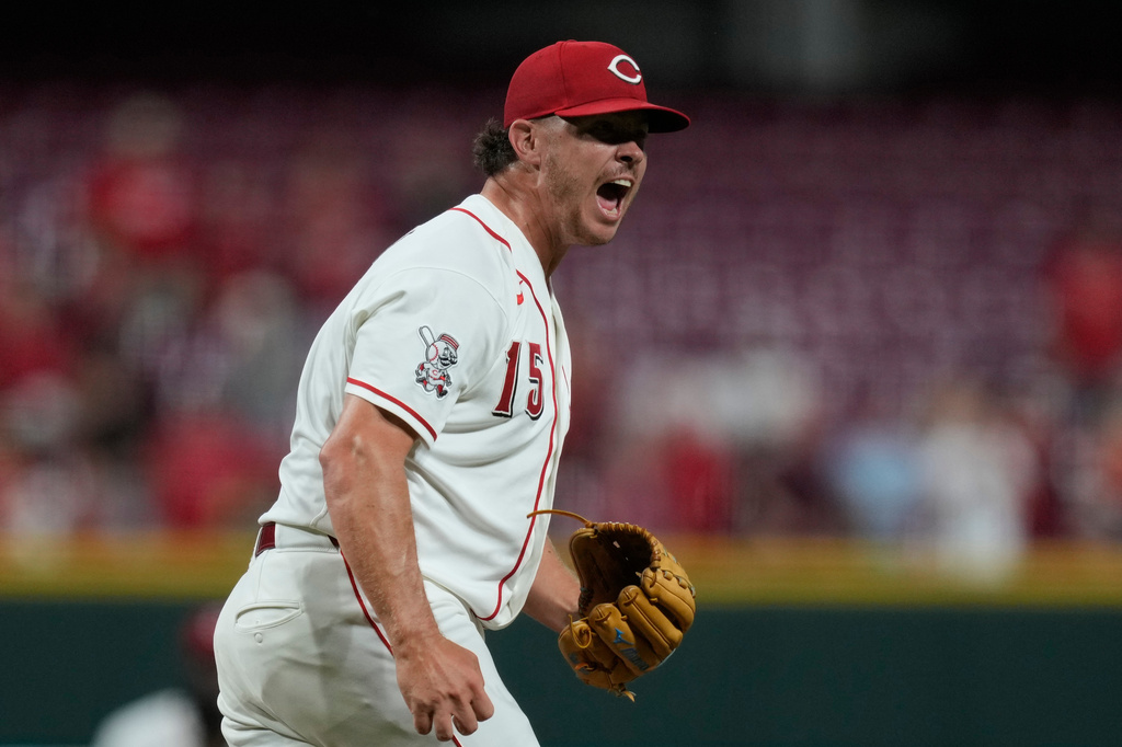 Cincinnati Reds pitcher Emilio Pagán reacts after striking out Athletics' Tommy White during the ninth inning to win a baseball game in Cincinnati, Wednesday, Aug. 5, 2026. (AP Photo/Carolyn Kaster)