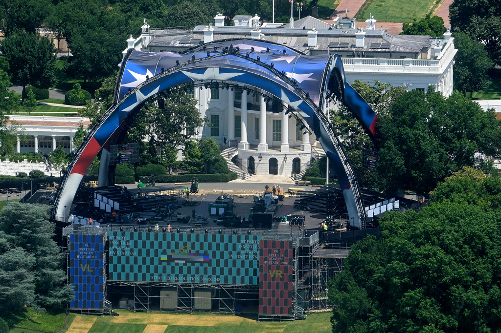 Workers continue building the stage for a future UFC fight on the South Lawn of the White House in Washington, Sunday, June 7, 2026. (AP Photo/Rod Lamkey, Jr.)