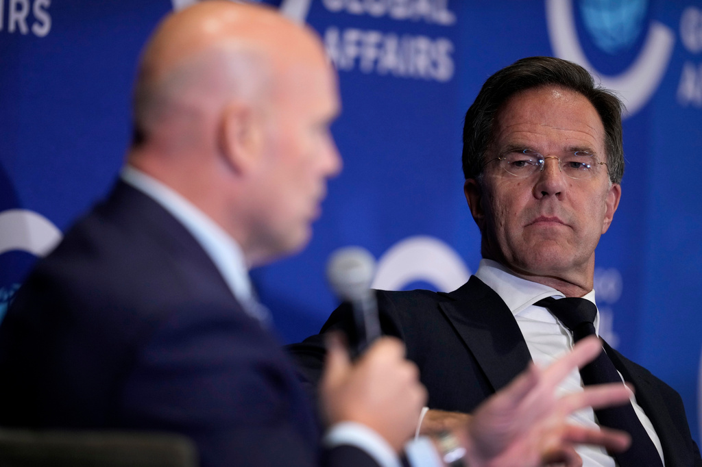 NATO Secretary General Mark Rutte listens to U.S. Ambassador to NATO Matthew Whitaker, left, speak during a forum hosted by The Chicago Council on Global Affairs, Tuesday, Sept. 22, 2026, in Des Moines, Iowa. (AP Photo/Charlie Neibergall)