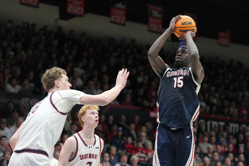 Gonzaga forward Graham Ike (15) shoots over Saint Mary's center Andrew McKeever (45) during the first half of an NCAA college basketball game in Moraga, Calif., Saturday, Feb. 28, 2026. (AP Photo/Tony Avelar)