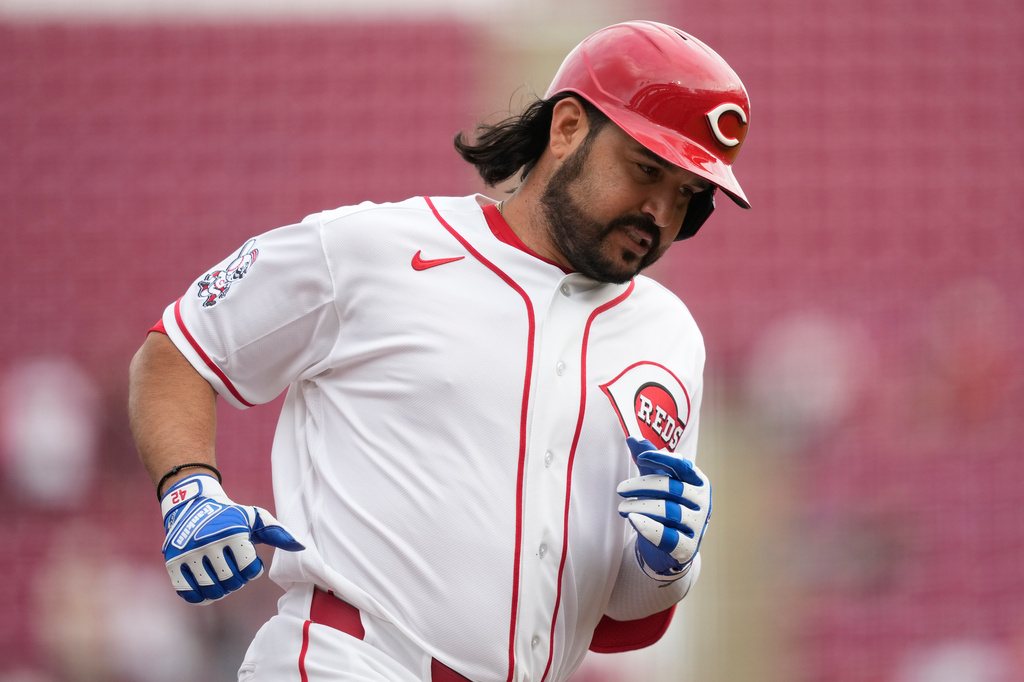 Cincinnati Reds' Eugenio Suárez rounds the bases after hitting a solo home run during the first inning of a baseball game against the San Francisco Giants in Cincinnati, Wednesday, April 15, 2026. (AP Photo/Carolyn Kaster)
