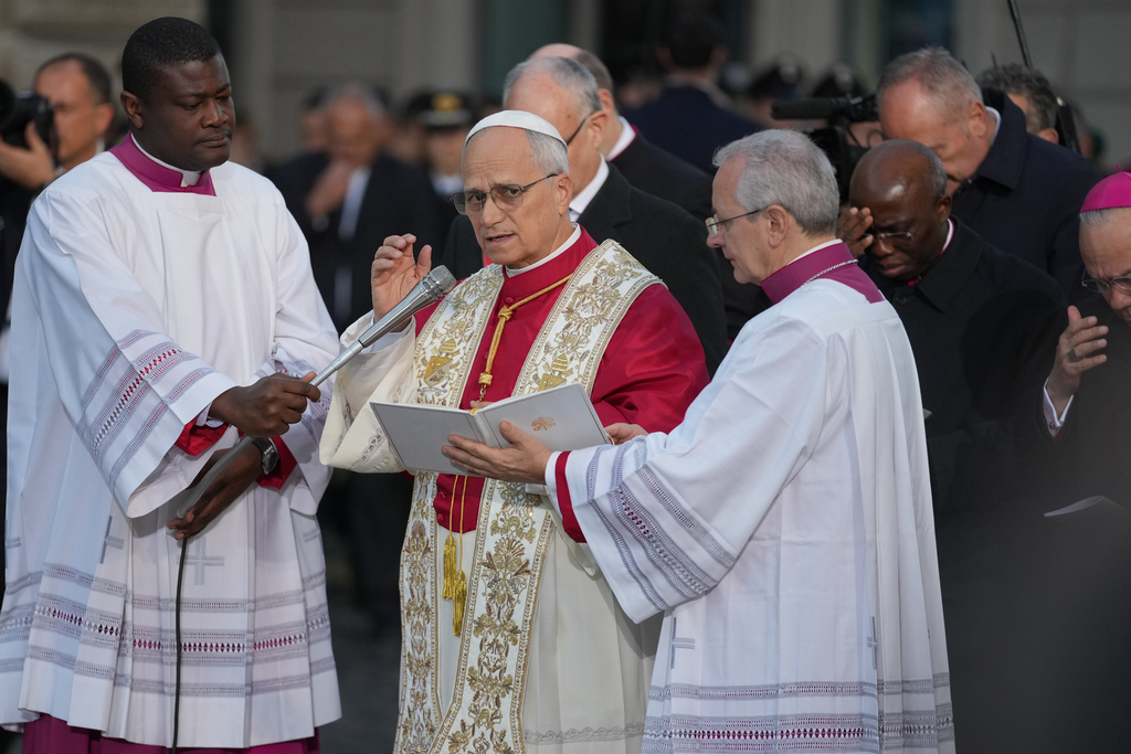 Pope Leo XIV leads the prayer in front of the statue of the Virgin Mary next to the Spanish Steps in Rome, Monday, Dec. 8, 2025, on the Catholic Feast of the Immaculate Conception. (AP Photo/Andrew Medichini)