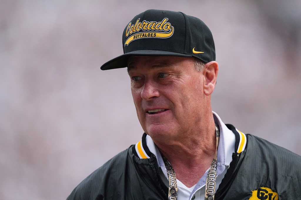 FILE - Colorado athletic director Rick George watches as players warm up before an NCAA college football game Aug. 29, 2025, in Boulder, Colo. (AP Photo/David Zalubowski, File)