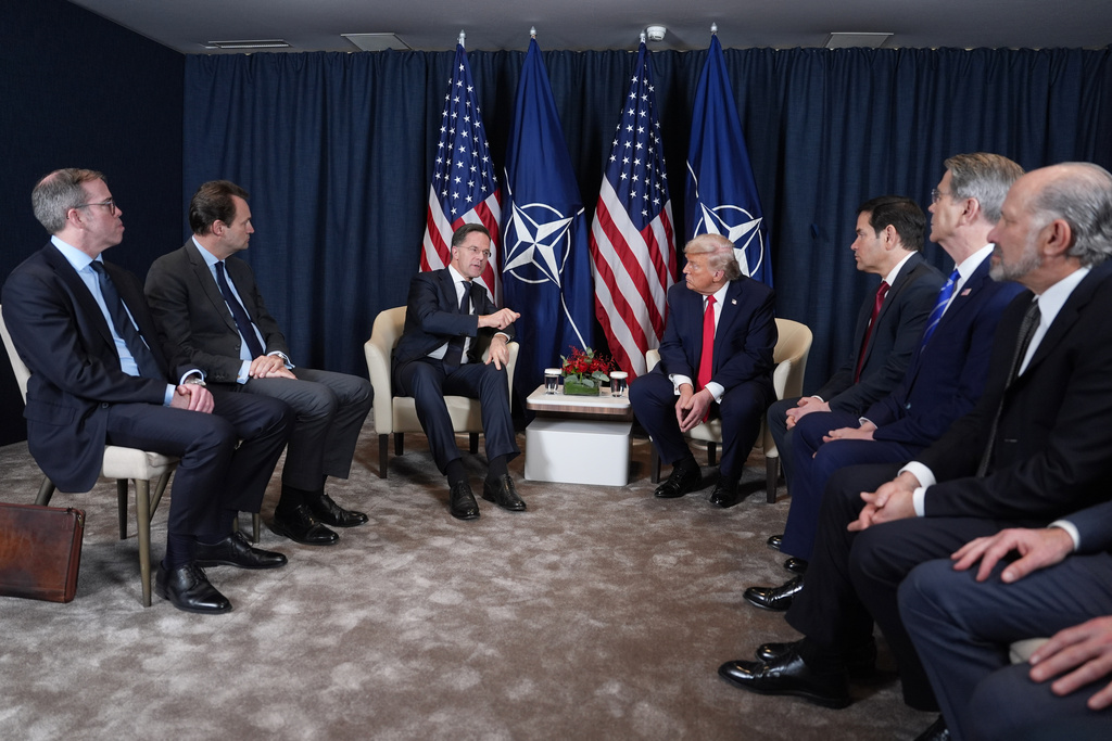 President Donald Trump, center right, meets with NATO Secretary General Mark Rutte, center left, during a meeting on the sidelines of the Annual Meeting of the World Economic Forum in Davos, Switzerland, Wednesday, Jan. 21, 2026. (AP Photo/Evan Vucci)