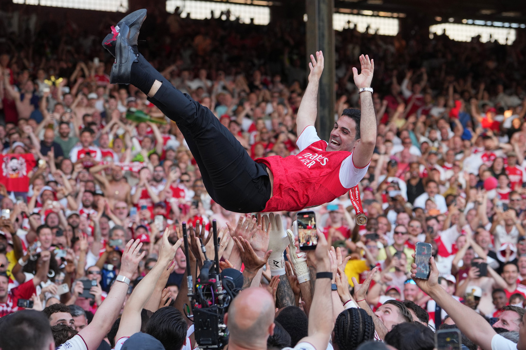 FILE - Arsenal's manager Mikel Arteta is thrown in the air by the players celebrating their Premier League title after the English Premier League soccer match between Crystal Palace and Arsenal in London, England, May 24, 2026. (AP Photo/Kin Cheung, File)