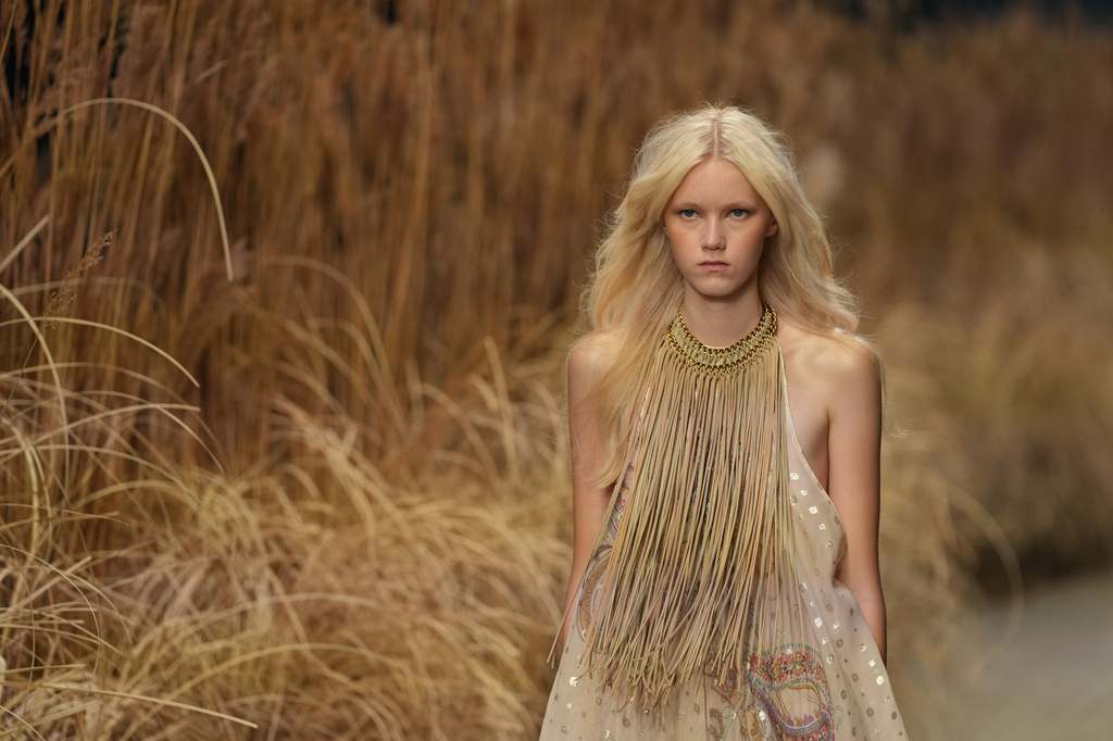 A model wears a creation part of the Etro women's Spring-Summer 2027 collection presented in Milan, Italy, Wednesday, Sept. 23, 2026. (AP Photo/Antonio Calanni).