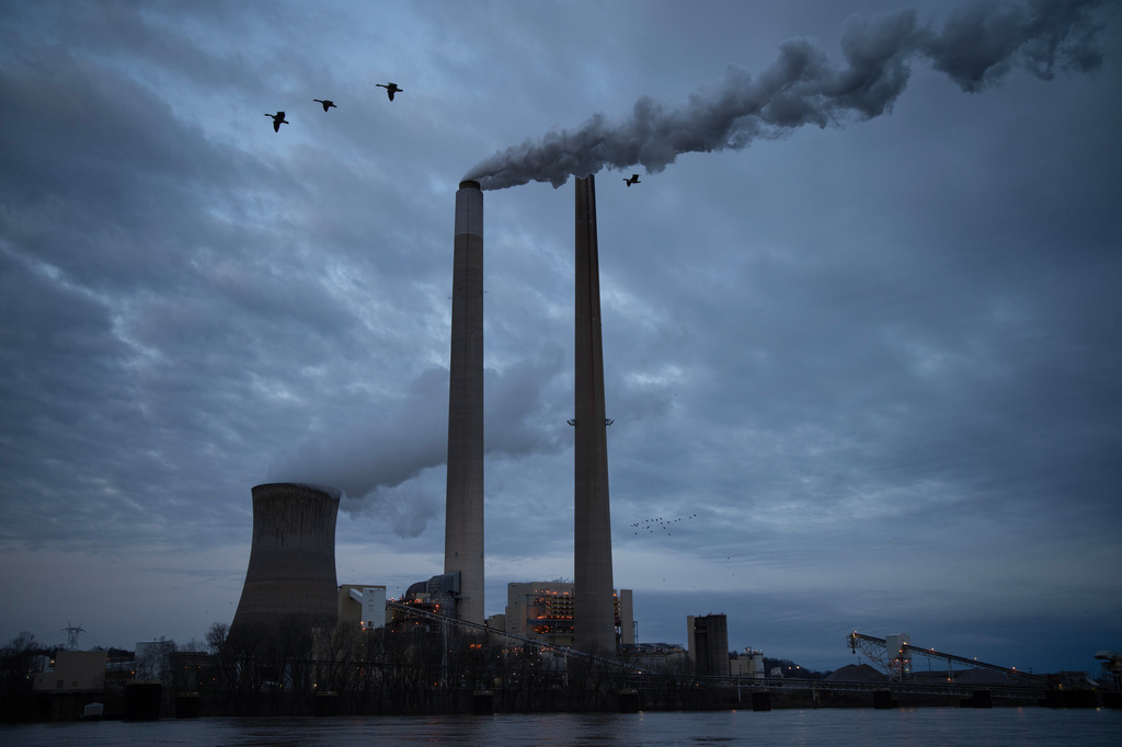 FILE - The coal-fired Mountaineer Power Plant, near New Haven, W.Va., operates across the Ohio River from the Lock 24 RV Park and Campground in Racine, Ohio, March 13, 2026. (AP Photo/Carolyn Kaster, File)