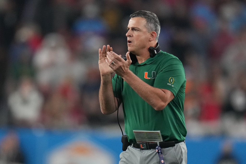 Miami head coach Mario Cristobal reacts after a touchdown during the first half of the Fiesta Bowl NCAA college football playoff semifinal game against Mississippi, Thursday, Jan. 8, 2026, in Glendale, Ariz. (AP Photo/Rick Scuteri)