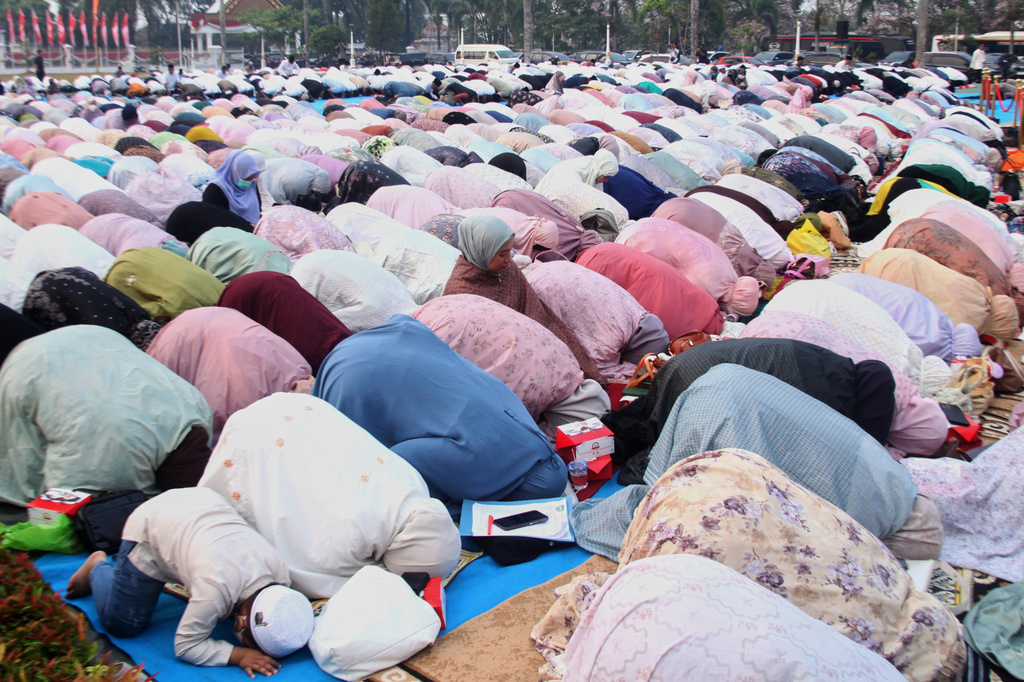 Indonesian Muslims perform a prayer requesting for rain following wildfires that burn through peatlands in several regions in Sumatra and Kalimantan Island, in Palembang, South Sumatra, Indonesia, Tuesday, Aug. 25, 2026. (AP Photo/Muhammad Fajri)