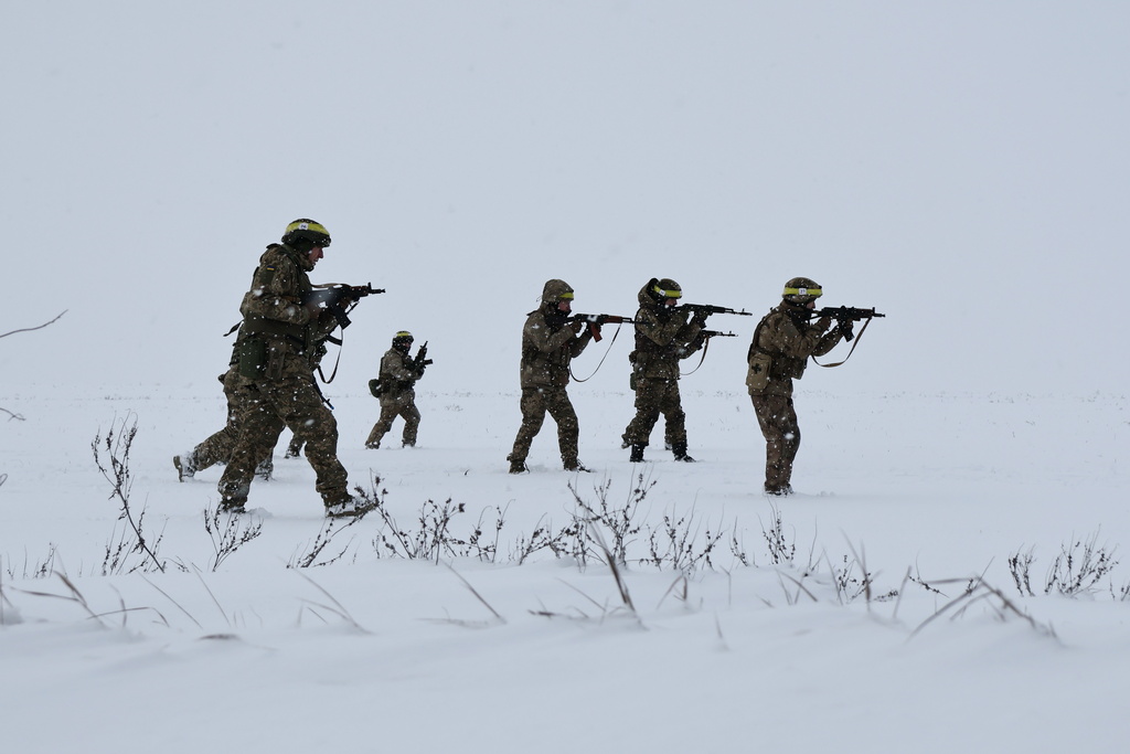 In this photo provided by Ukraine's 65th Mechanized Brigade press service, recruits attend drills at a training ground in the Zaporizhzhia region, Ukraine, Monday, Dec. 29, 2025. (Andriy Andriyenko/Ukraine's 65th Mechanized Brigade via AP)