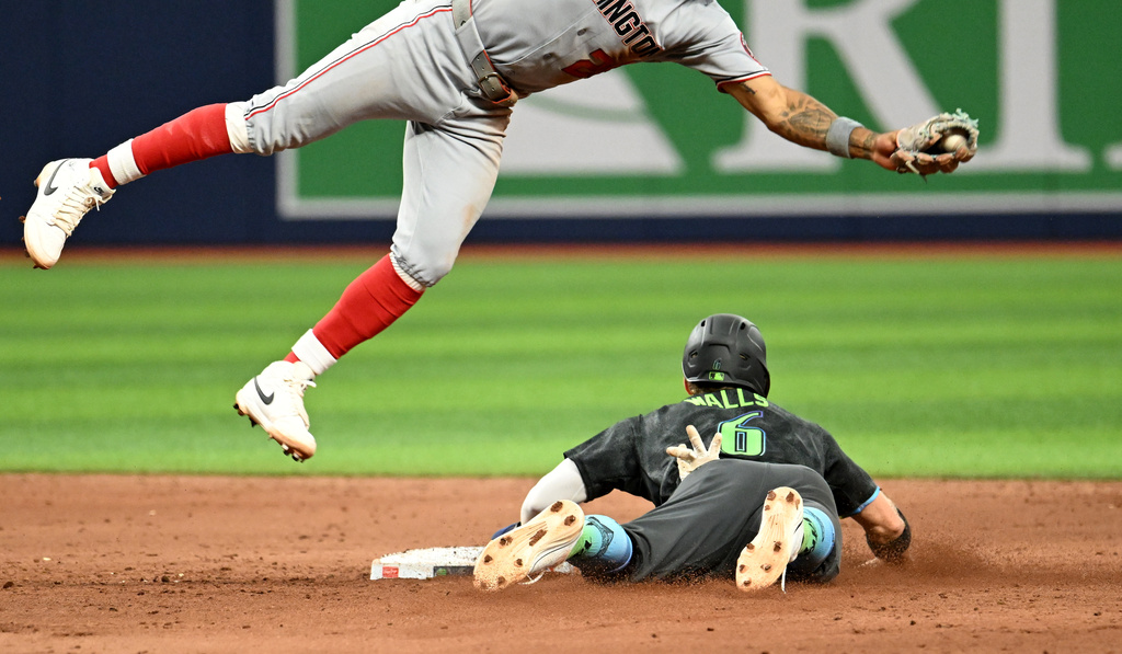 Tampa Bay Rays' Taylor Walls (6) steals second base before the take from Washington Nationals second baseman Nasim Nuñez during the ninth inning of a baseball game Saturday, June 20, 2026, in St. Petersburg, Fla. (AP Photo/Jason Behnken)