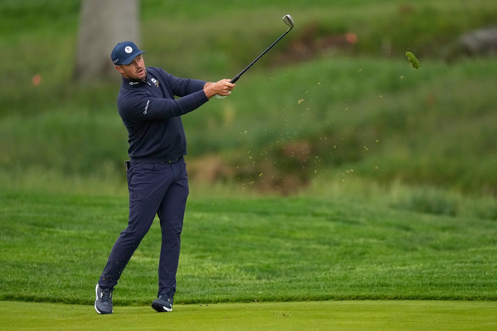 Bryson DeChambeau hits from the fairway on the 10th hole during the first round of the PGA Championship golf tournament practice round at Aronimink Golf Club, Thursday, May 14, 2026, in Newtown Square, PA. (AP Photo/Frank Franklin II)