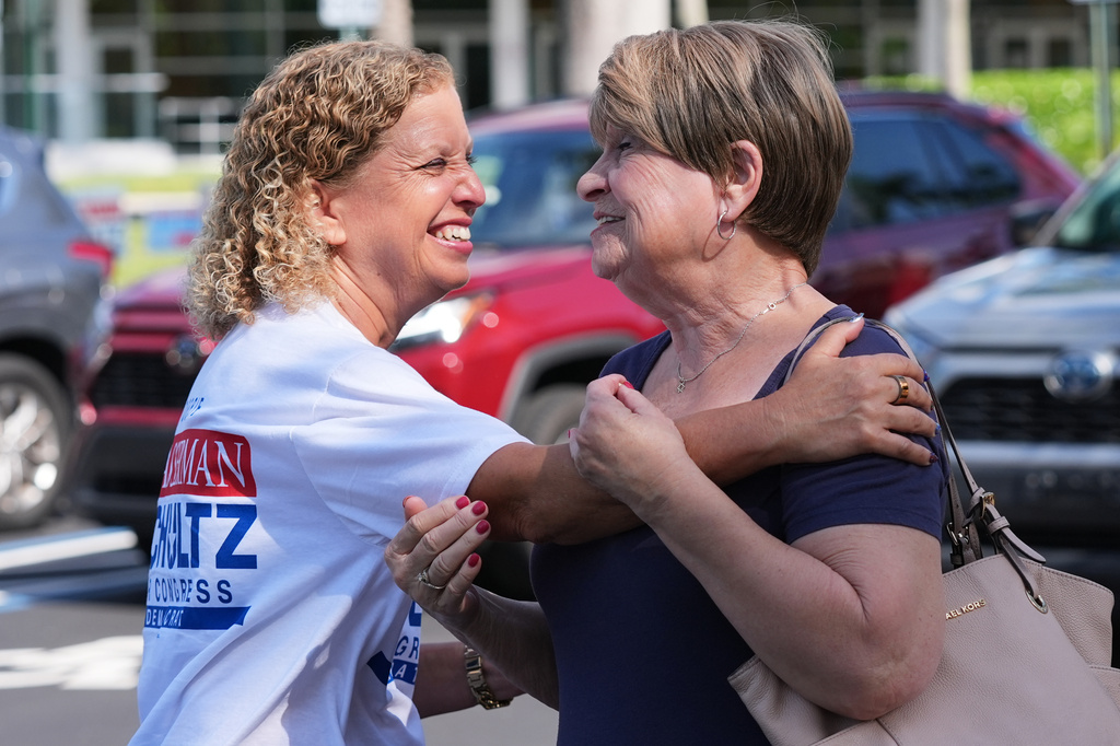 U.S. Rep. Debbie Wasserman Schultz, left, greets voters while campaigning for Florida's 20th congressional district in the Florida primary election, Tuesday, Aug. 18, 2026, in Tamarac, Fla. (AP Photo/Lynne Sladky)
