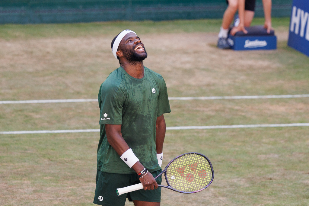 United States' Frances Tiafoe celebrates winning the final match against United States' Taylor Fritz at the ATP Germany Open tennis tournament in Halle, Germany, Sunday, June 21, 2026. (Friso Gentsch/dpa via AP)