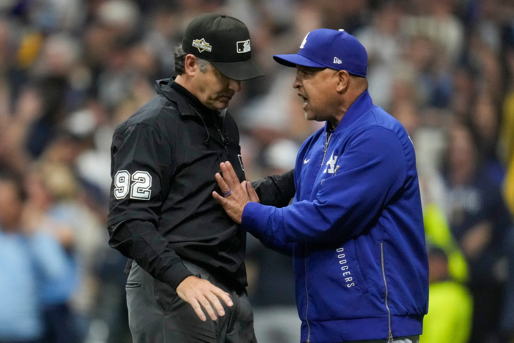 Los Angeles Dodgers manager Dave Roberts argues with umpire James Hoys during the fourth inning in Game 1 of baseball's National League Championship Series, Monday, Oct. 13, 2025, in Milwaukee. (AP Photo/Ashley Landis)