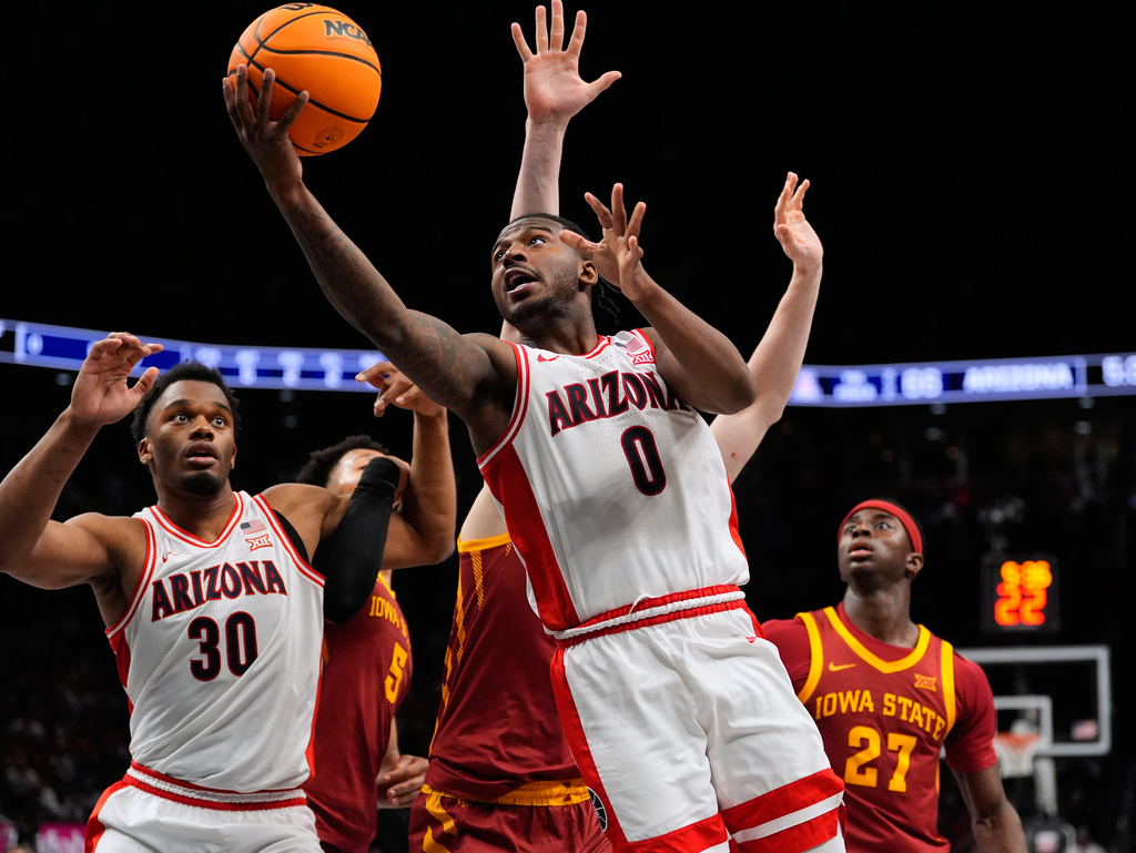 Arizona's Jaden Bradley (0) heads to the basket during the second half of an NCAA college basketball game against Iowa State in the semifinal round of the Big 12 Conference tournament Friday, March 13, 2026, in Kansas City, Mo. (AP Photo/Charlie Riedel)