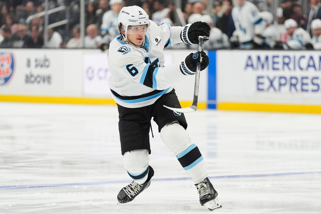 FILE - Utah Mammoth defenseman John Marino (6) hits the puck during the third period of an NHL hockey game against the Los Angeles Kings, March 28, 2026, in Los Angeles. (AP Photo/Jae C. Hong, File)