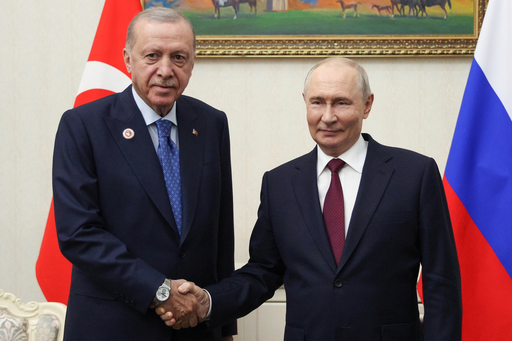 Russian President Vladimir Putin, right, and Turkish President Recep Tayyip Erdogan pose for a photo during their meeting on the sidelines of the Shanghai Cooperation Organization (SCO), in Bishkek, Kyrgyzstan, on Tuesday, Sept. 1, 2026. (Vyacheslav Prokofyev, Sputnik, Kremlin Pool Photo via AP)