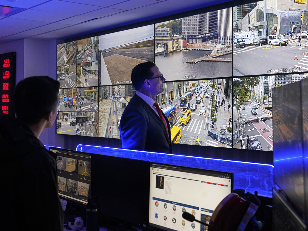 U.S. Secret Service Special Agent in Charge Matt McCool, center, looks at live video surveillance feeds in the agency's New York Field Office, in the Brooklyn borough of New York, Monday, Sept. 22, 2025. (AP Photo/Richard Drew)