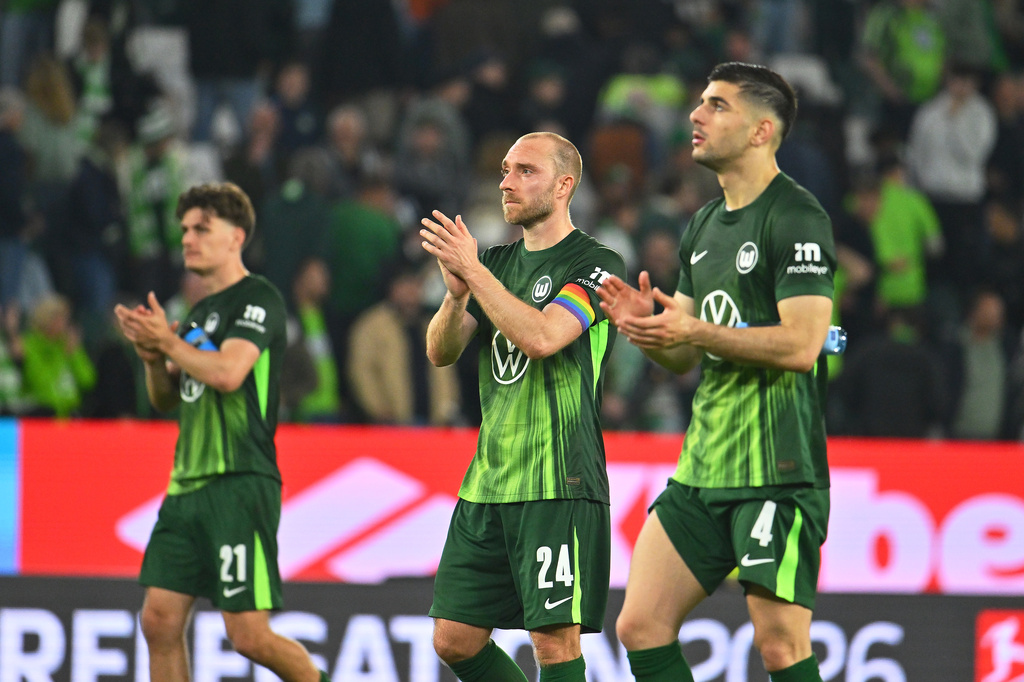 Wolfsburg's Christian Eriksen applauds after a Bundesliga first leg relegation soccer match between VfL Wolfsburg and SC Paderborn 07, Thursday, May 21, 2026, in Wolfsburg, Germany. (Swen Pförtner/dpa via AP)