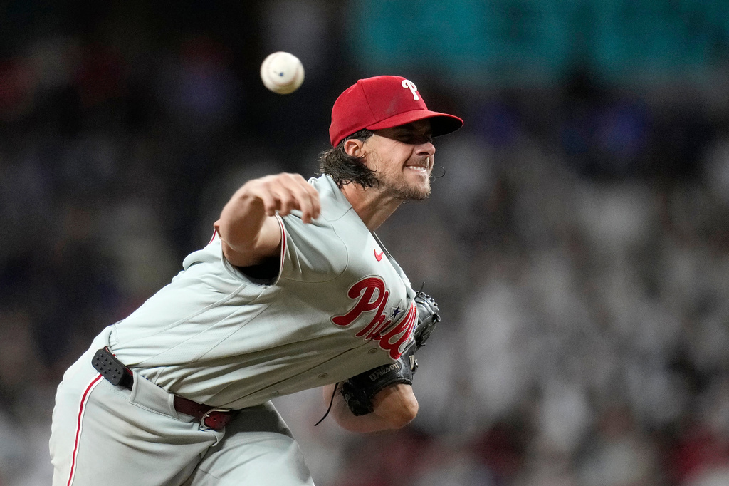 Philadelphia Phillies starting pitcher Aaron Nola throws against the Arizona Diamondbacks during the first inning of a baseball game, Monday, Aug. 31, 2026, in Phoenix. (AP Photo/Ross D. Franklin)