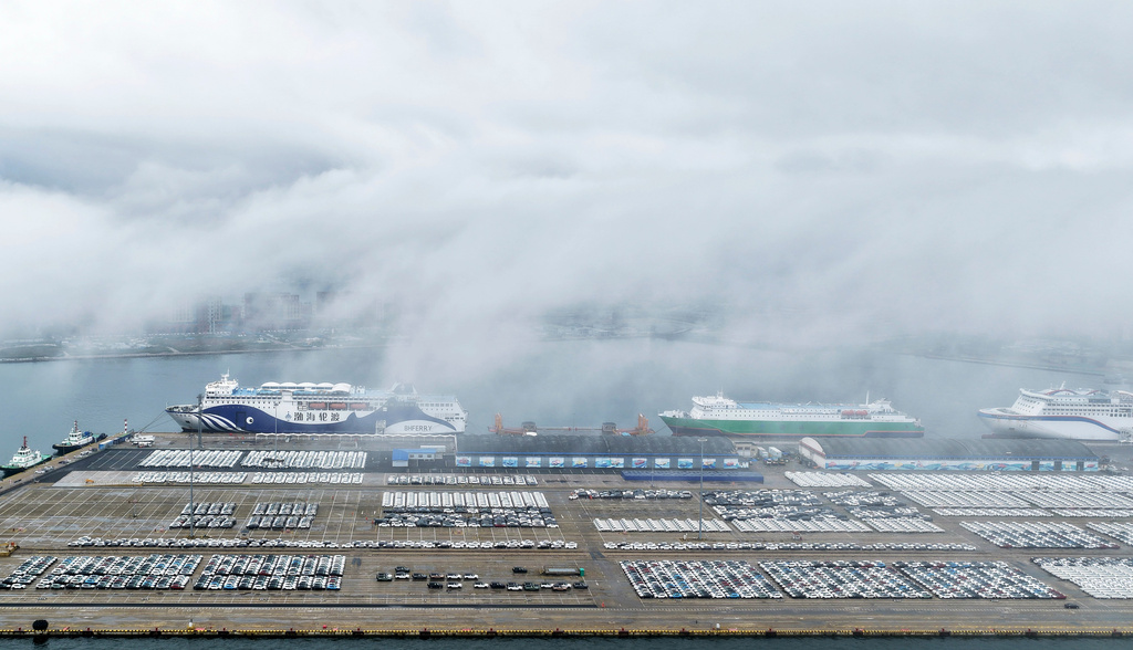 Vehicles wait for shipment to overseas markets in Yantai, eastern China's Shandong province, Tuesday, July 14, 2026. (Chinatopix via AP)