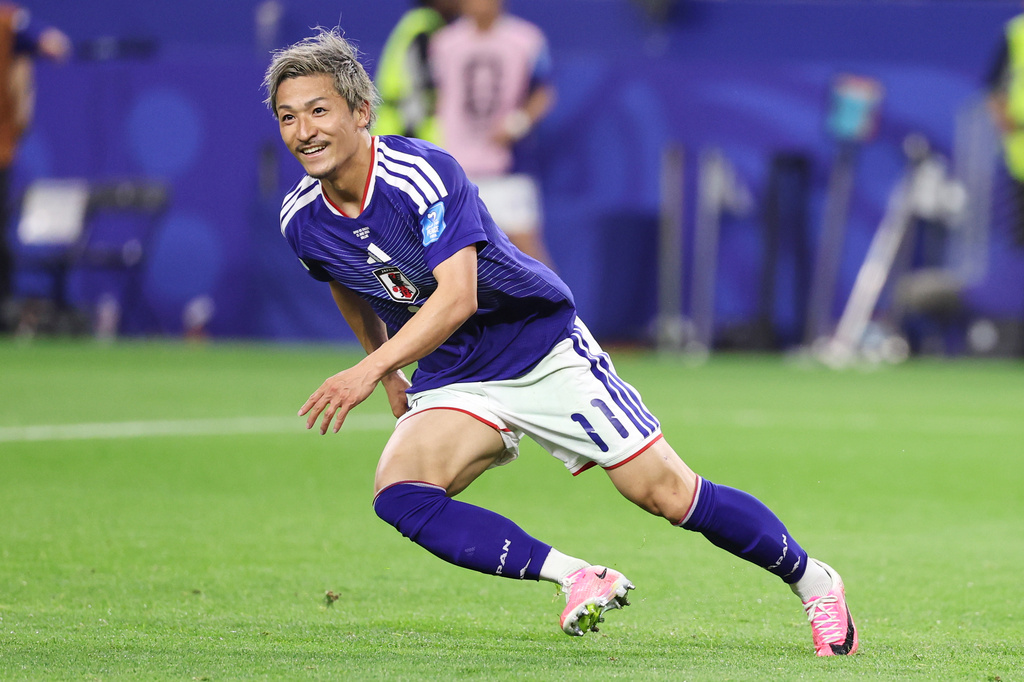Japan's Daizen Maeda (11) reacts after scoring his team's first goal during the World Cup Group F soccer match between Japan and Sweden in Arlington, Texas, near Dallas, Thursday, June 25, 2026. (AP Photo/Sam Hodde)
