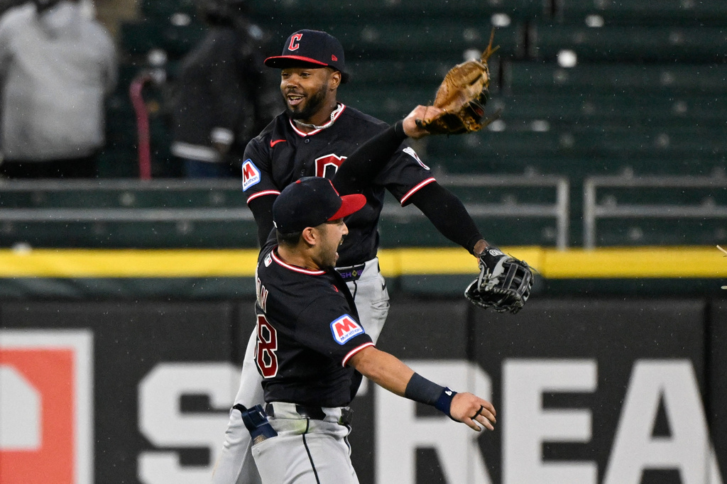 Cleveland Guardians center fielder Steven Kwan, front, and right fielder Kahlil Watson celebrate after a baseball game against the Chicago White Sox, Wednesday, June 24, 2026, in Chicago. (AP Photo/Matt Marton)