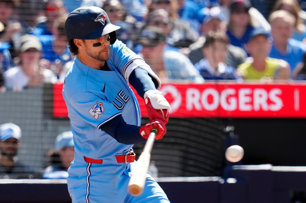 Toronto Blue Jays' Ernie Clement (22) hits a three-run home run during the third inning of a baseball game against the Baltimore Orioles, Saturday, June 6, 2026, in Toronto. (Frank Gunn/The Canadian Press via AP)