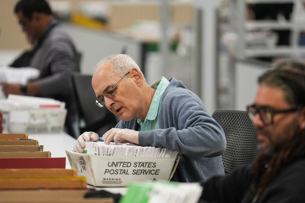 Workers sort ballots the day after California's primary election at the Los Angeles County Ballot Processing Center Wednesday, June 3, 2026, in City of Industry, Calif. (AP Photo/Jae C. Hong)