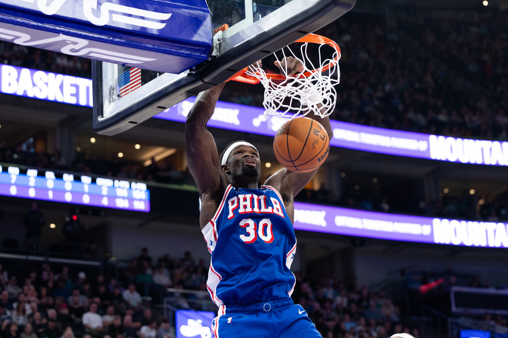 Philadelphia 76ers center Adem Bona dunks during the first half of an NBA basketball game against the Utah Jazz, Saturday, March 21, 2026, in Salt Lake City. (AP Photo/Anna Fuder)