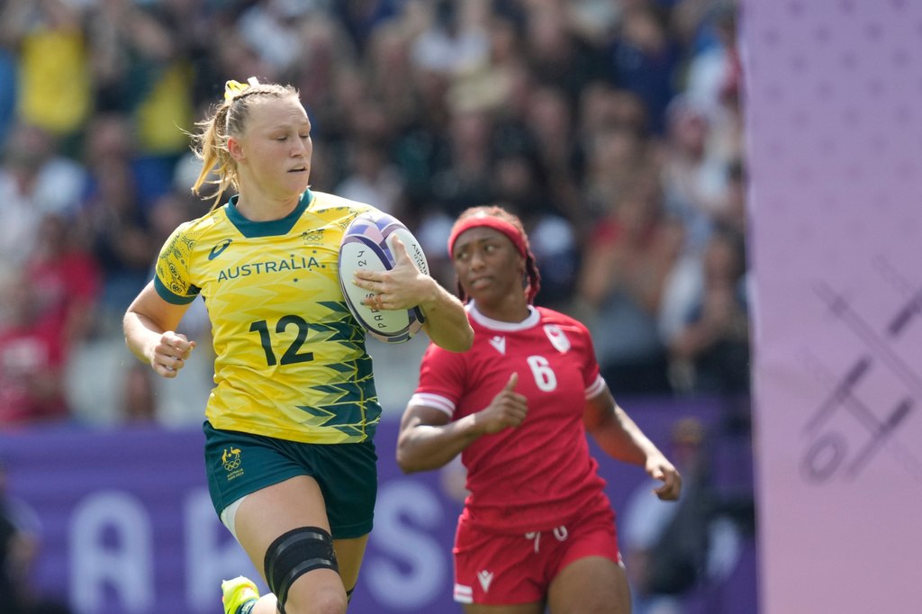 FILE - Australia's Maddison Levi runs over the line and scores a try during the women's semifinal Rugby Sevens match between Canada and Australia at the 2024 Summer Olympics, in the Stade de France, in Saint-Denis, France, Tuesday, July 30, 2024. (AP Photo/Vadim Ghirda,File)