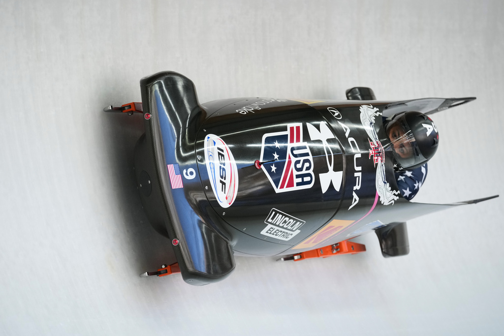 Kaysha Love and Azaria Hill, of the United States, race down the course during the 2-woman bobsleigh World Cup and Olympic test event in Cortina D'Ampezzo, Italy, Sunday, Nov. 23, 2025. (AP Photo/Andrew Medichini)