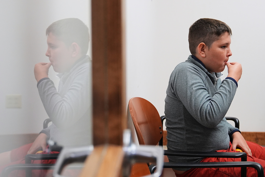 Ethan Blanchfield-Killeen, 11, of Yonkers, N.Y., who has a form of juvenile idiopathic arthritis, takes his medication at the Frost Valley YMCA sleepaway camp in Claryville, N.Y., Thursday, July 31, 2025. The camp partnered with Children's Hospital at Montefiore so kids with autoimmune diseases could attend for the first time. (AP Photo/Matt Rourke)