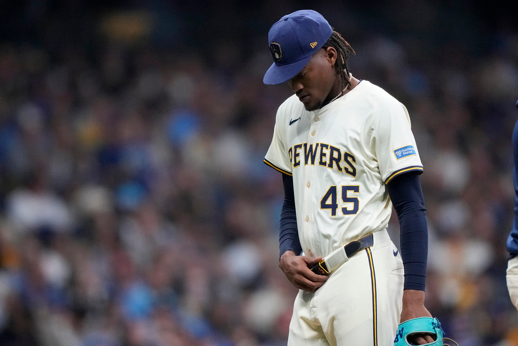Milwaukee Brewers pitcher Abner Uribe leaves the game against the Los Angeles Dodgers during the seventh inning in Game 2 of baseball's National League Championship Series, Tuesday, Oct. 14, 2025, in Milwaukee. (AP Photo/Brynn Anderson)